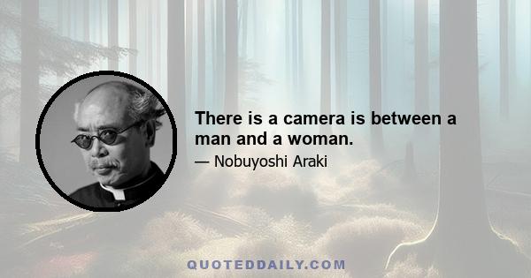 There is a camera is between a man and a woman.